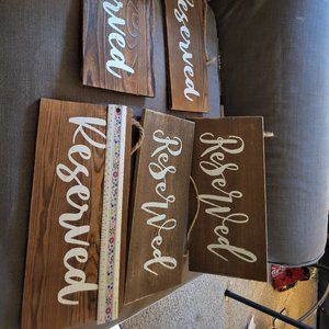 Five RESERVED signs for wedding